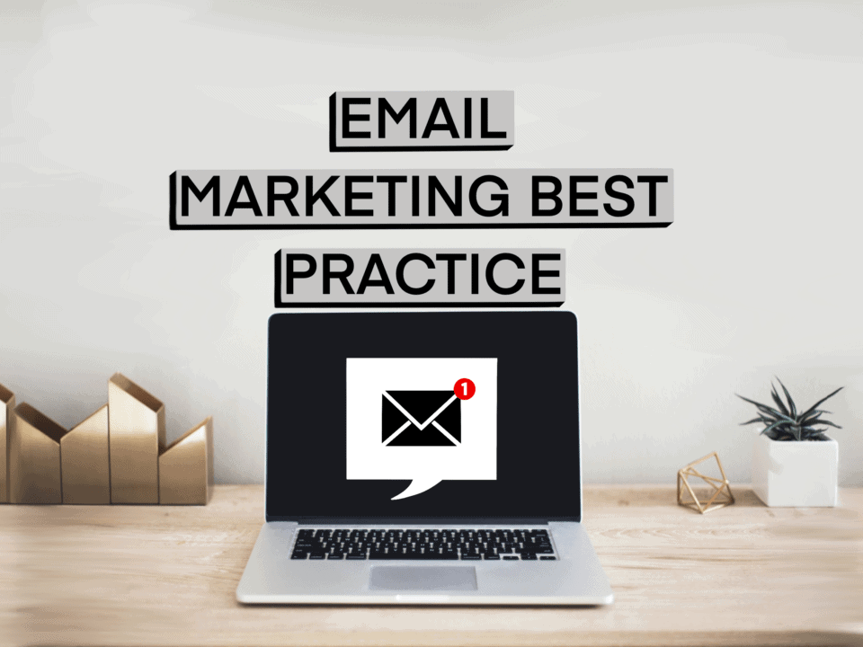 image of note reading email marketing best practice with a laptop and a plant pot and couple of other ornaments on a desk top.