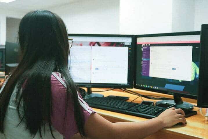 image showing a person sitting in front of dual monitors of a computer for the article Take ownership of your unsbscribers