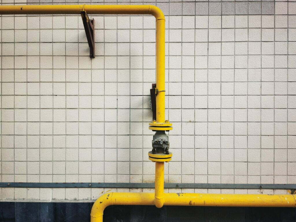 yellow pipeline against tiled background representing sales pipelines