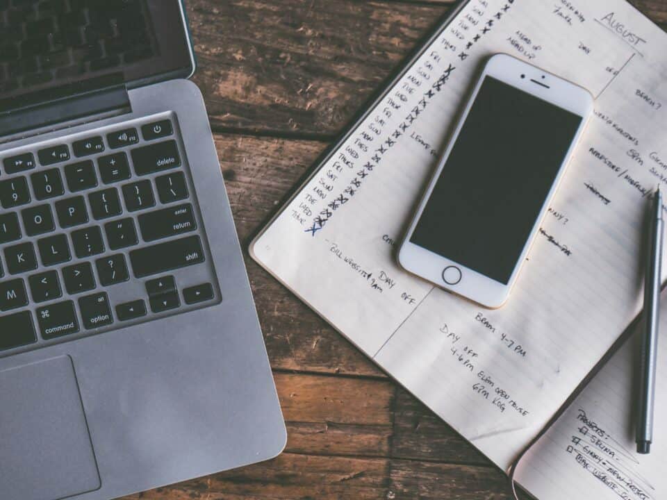 photo for Your Contacts article displaying image of laptop and phone on a desk