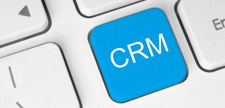 close up image of a blue keyboard key that reads CRM in white for the article Investing Money In CRM Database – Worth It Or Not?
