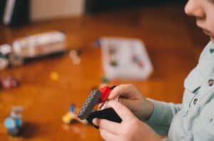 small child playing with lego to indicate building sales pipelines popcorn