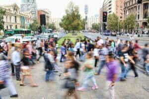 picture of crowd crossing road on busy street example of location for guerrilla marketing article