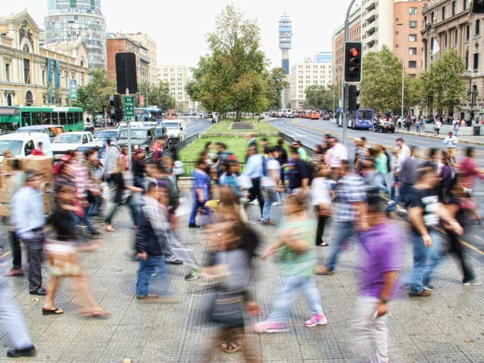 picture of crowd crossing road on busy street example of location for guerrilla marketing article