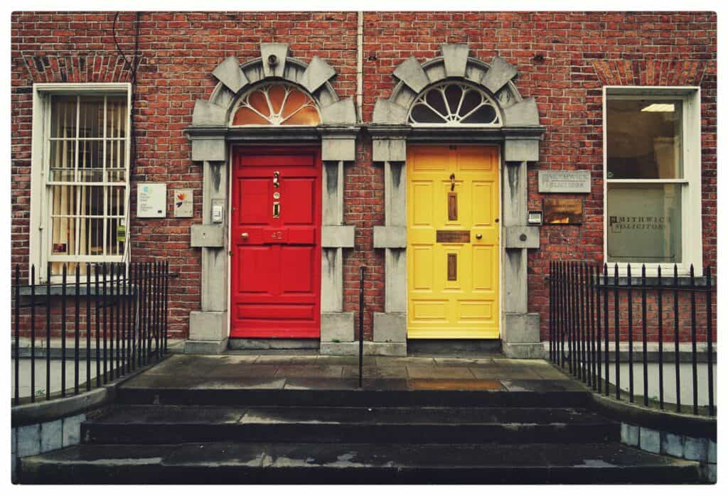 red wooden door and yellow wooden door on townhouses for how to optimise your multi channel marketing for small business article