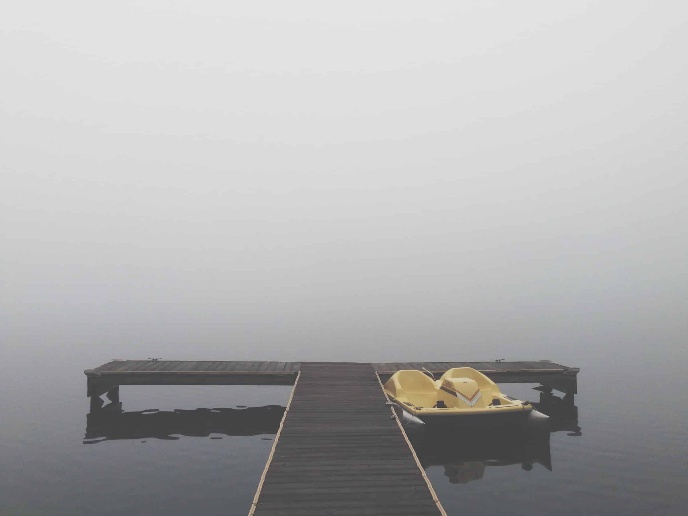 moored paddleboat on foggy lake for sales pipelines sales process article
