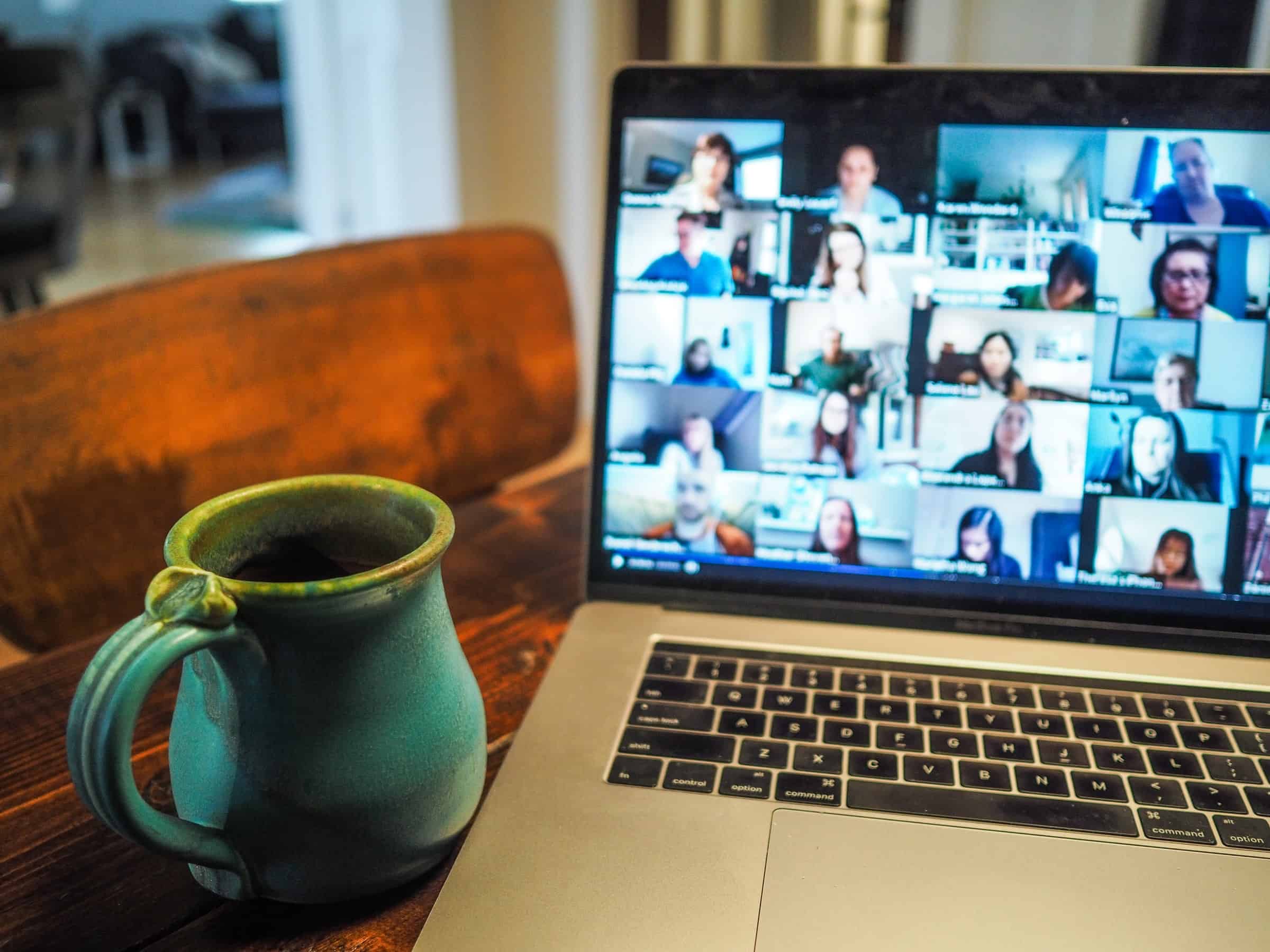 macbook displaying group video call for retain customers article