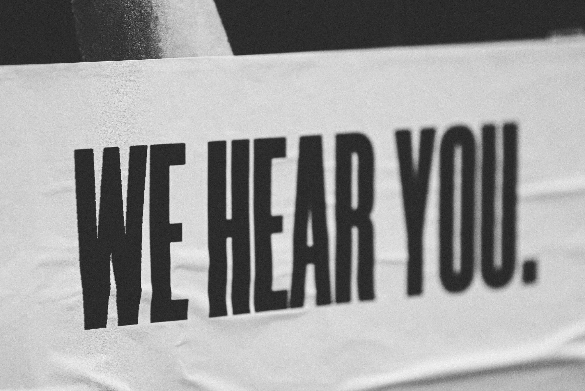 banner with the words 'we hear you' in bold and capitalised for best customer service article