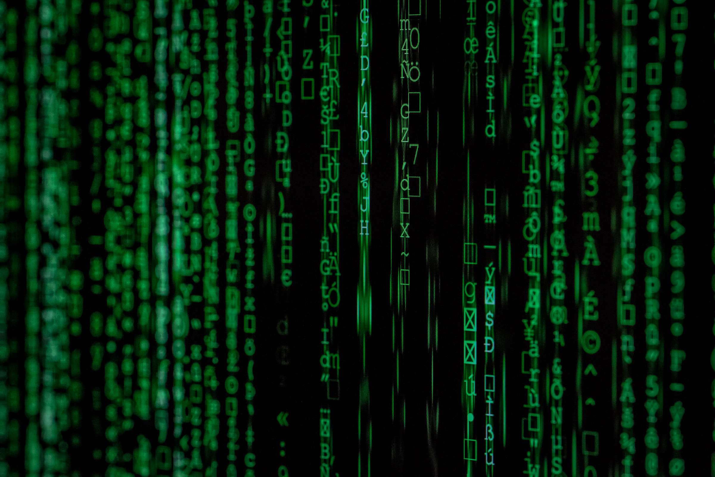 binary code in green for humanising ai automation article