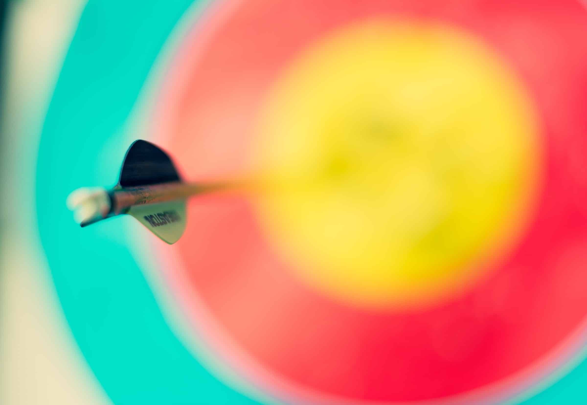 selective focus photography of a dart on a dart board for prospect conversion article